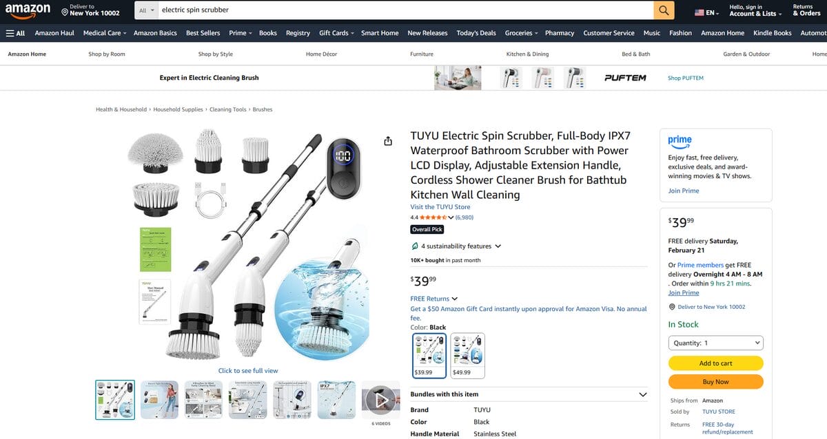 A cordless electric spin scrubber with various brush heads, cleaning bathroom tiles with ease for a Q1 deep clean.
