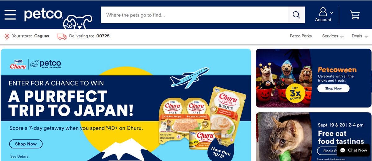 Petco homepage featuring cat food, Halloween pet costumes, and a promotion for pet treats